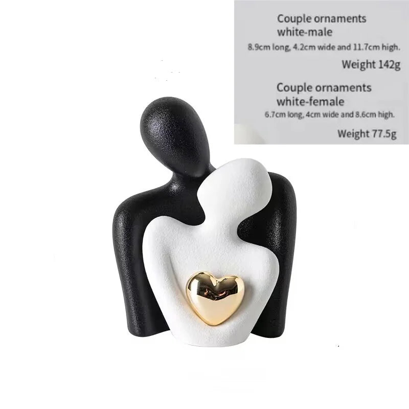Decoratie woonkamer accessoires - Zwarte en witte sculpturen met gouden hart voor romantische sfeer