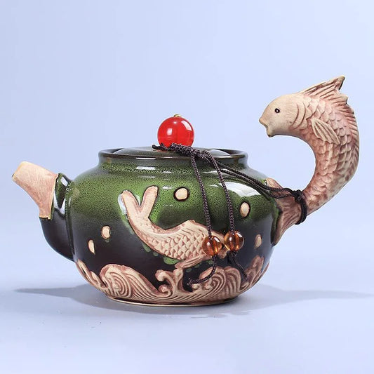 Glazen theepot met theelichtje onderin