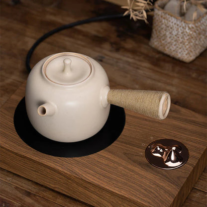 Theepot met houten handvat en infuser