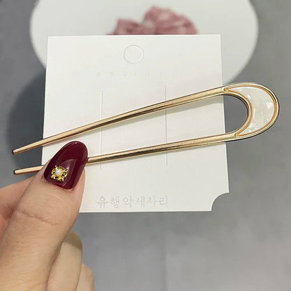 Minimalistische haar accessoires in goudkleur