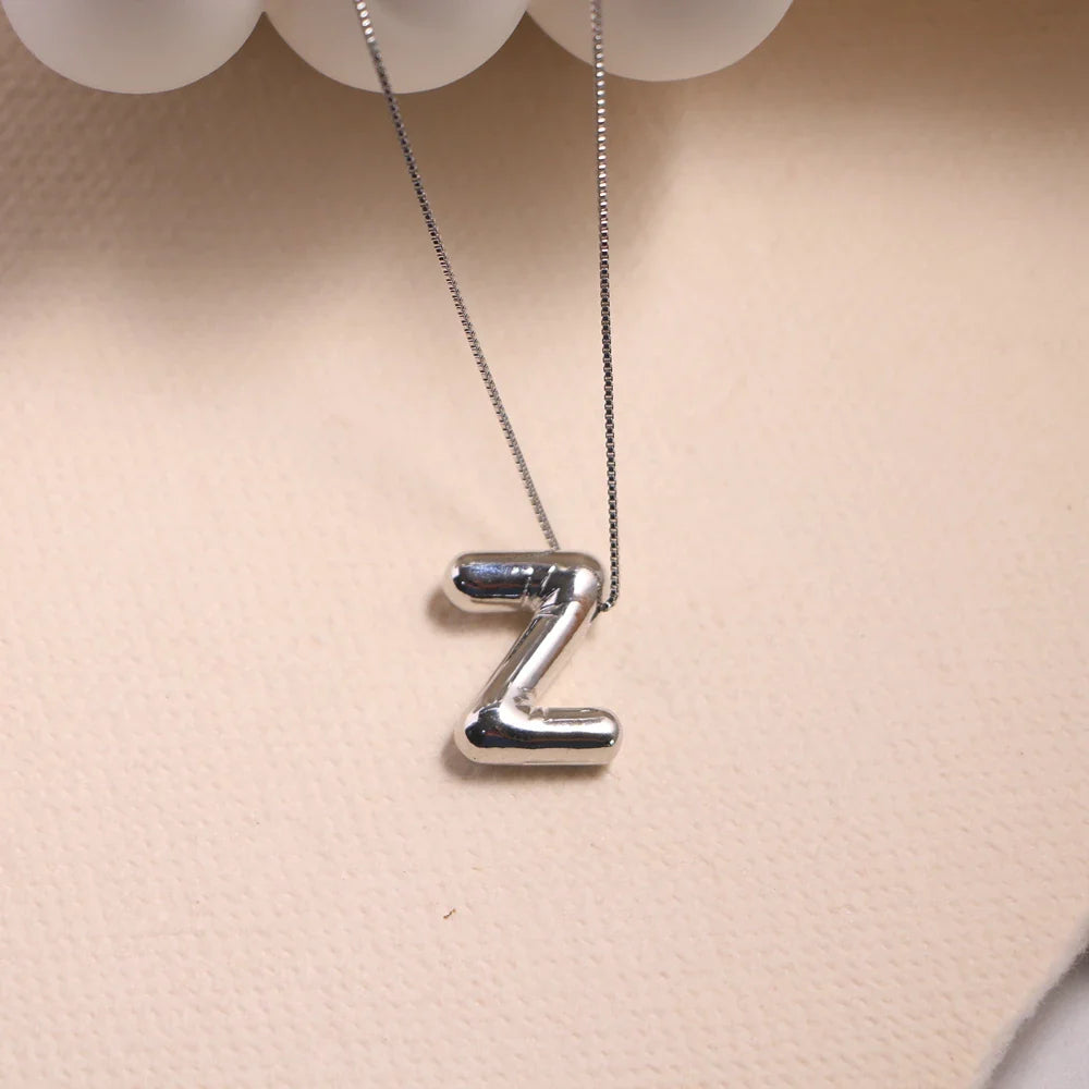 Ketting met naam gegraveerd in sierlijke cirkel