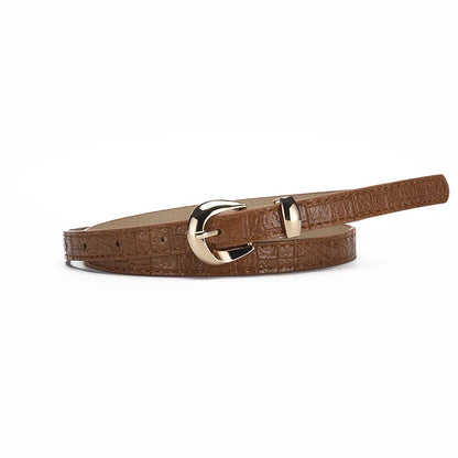 Goudkleurige gesp als eyecatcher bij deze riem