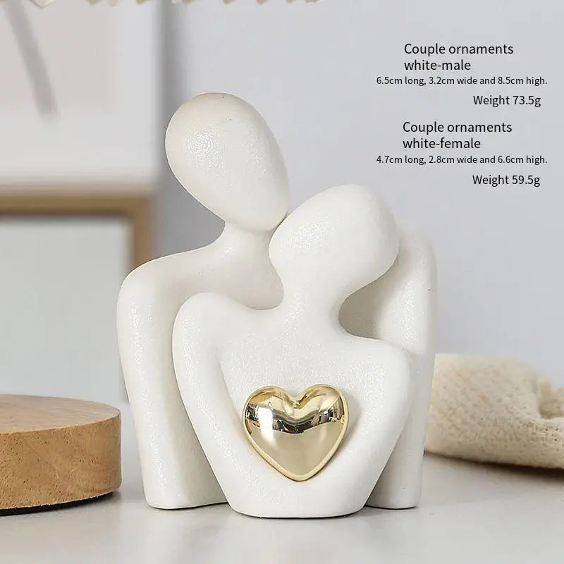 Decoratie woonkamer accessoires - Zwarte en witte sculpturen met gouden hart voor romantische sfeer