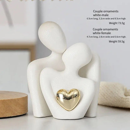 Decoratie woonkamer accessoires - Zwarte en witte sculpturen met gouden hart voor romantische sfeer