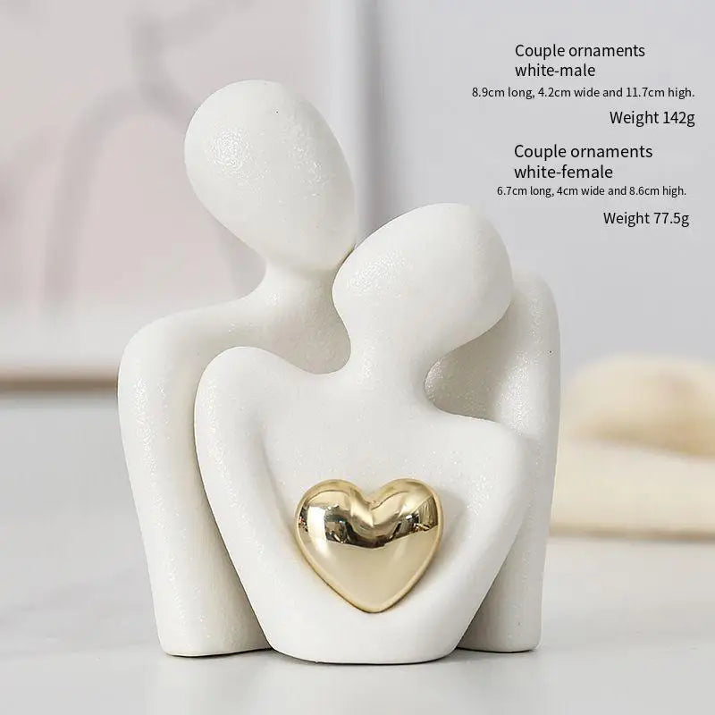 Decoratie woonkamer accessoires - Zwarte en witte sculpturen met gouden hart voor romantische sfeer