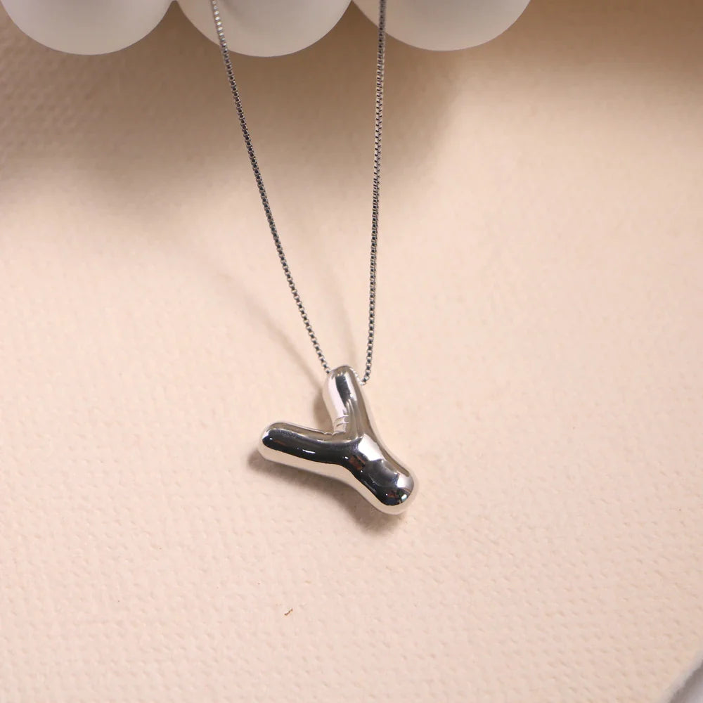 Zachte naamketting met ronde vormen