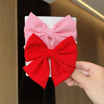 Fluwelen haar accessoires in warme kleuren