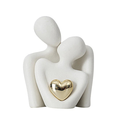 Decoratie woonkamer accessoires - Zwarte en witte sculpturen met gouden hart voor romantische sfeer