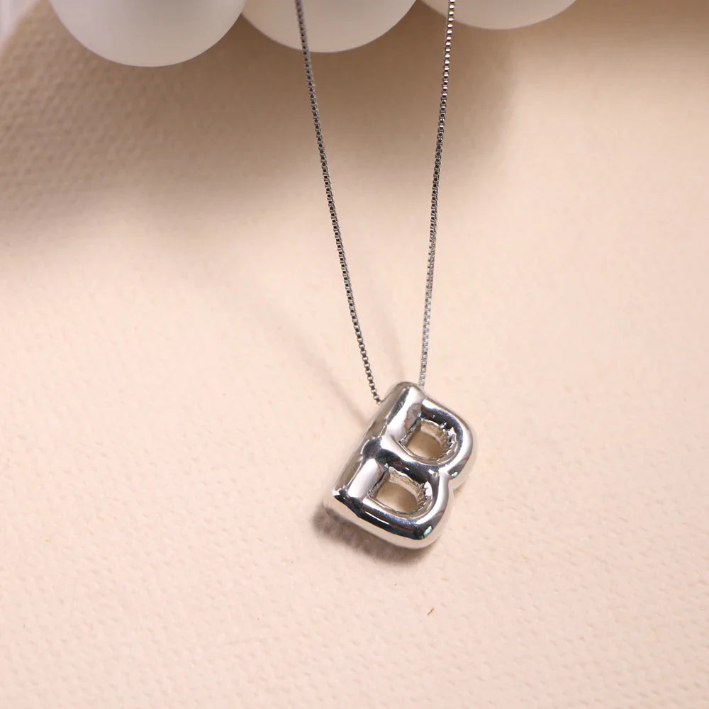 Ketting met naamplaatje en hartvormig detail