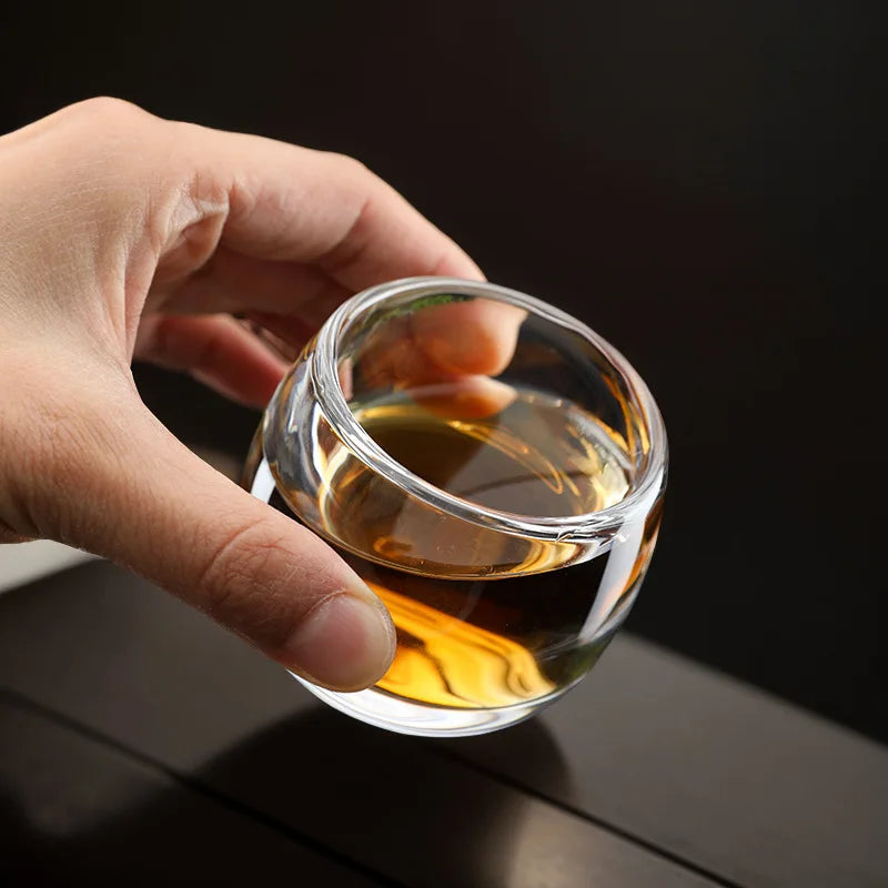 Glazen theepot met theelichtje onderin