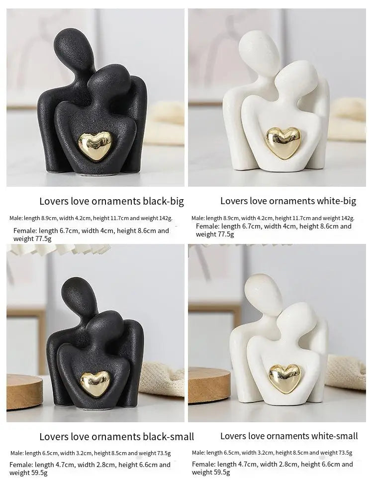 Decoratie woonkamer accessoires - Zwarte en witte sculpturen met gouden hart voor romantische sfeer
