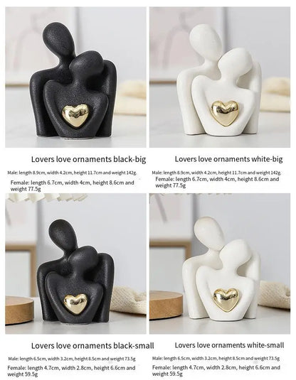 Decoratie woonkamer accessoires - Zwarte en witte sculpturen met gouden hart voor romantische sfeer