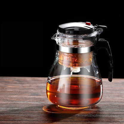 Elegante glazen theepot met metalen zeef