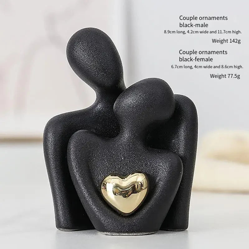 Decoratie woonkamer accessoires - Zwarte en witte sculpturen met gouden hart voor romantische sfeer