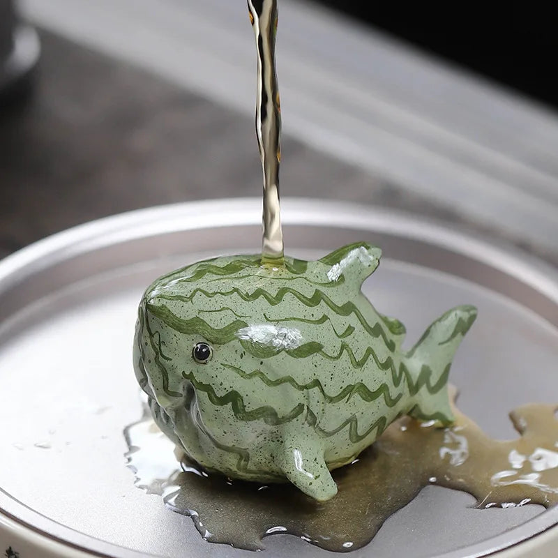 Glazen theepot met theelichtje onderin
