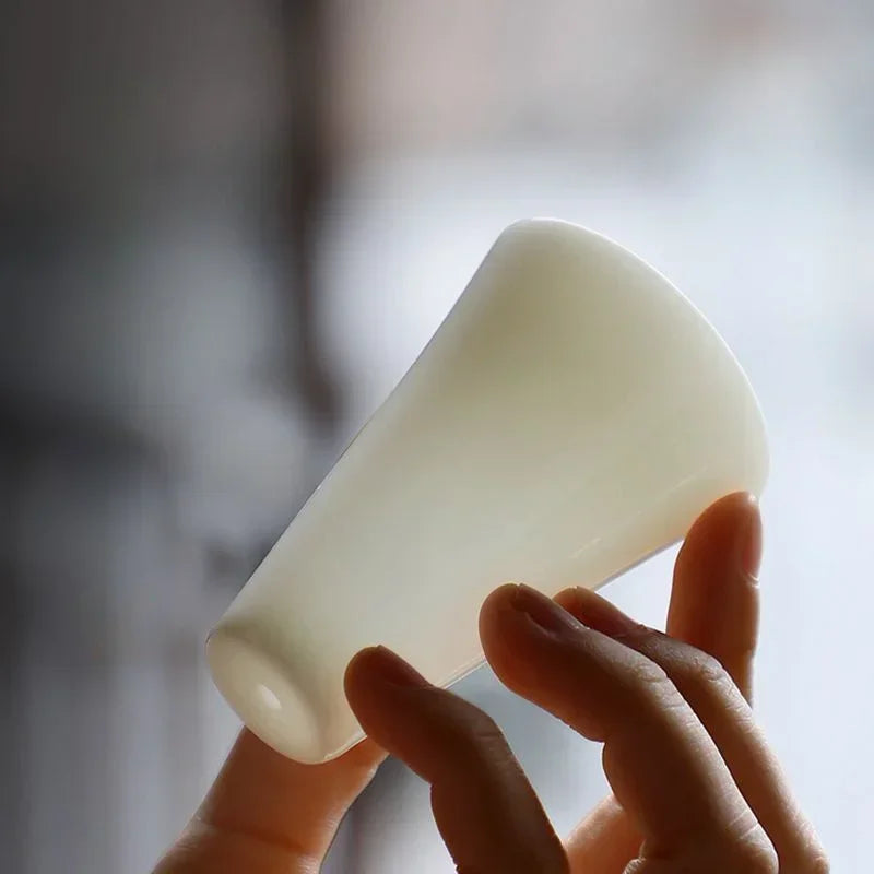 Glazen theepot met theelichtje onderin