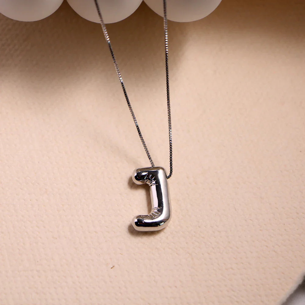Ketting met gegraveerde naam op muntvormige hanger