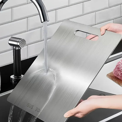 Snijplank met geïntegreerd messenrek
